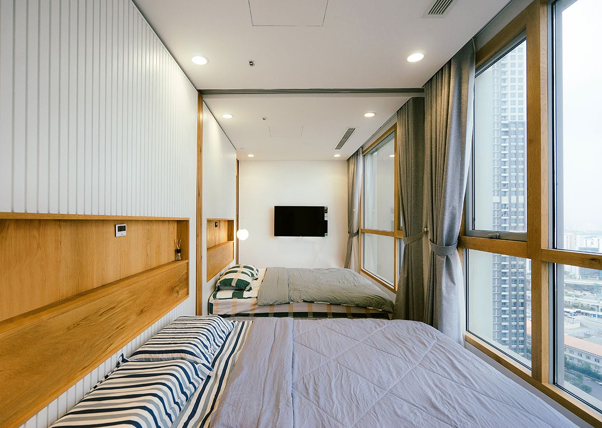 客厅卧室打通隔断折叠推拉门,门挨门相邻两套房打通装修效果图