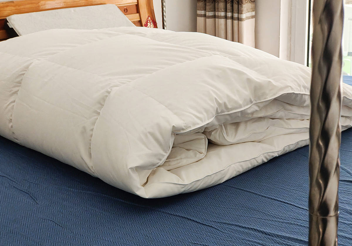 冬天盖鹅绒被暖和吗,夏天睡鹅绒被的体验