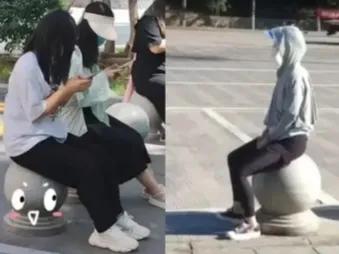 西安一女子痛经坐石墩,西安石头墩子治痛经